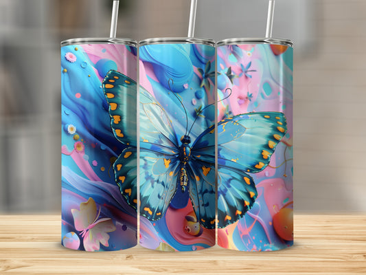 Three tumblers with a blue butterfly and floral design on a wooden surface.