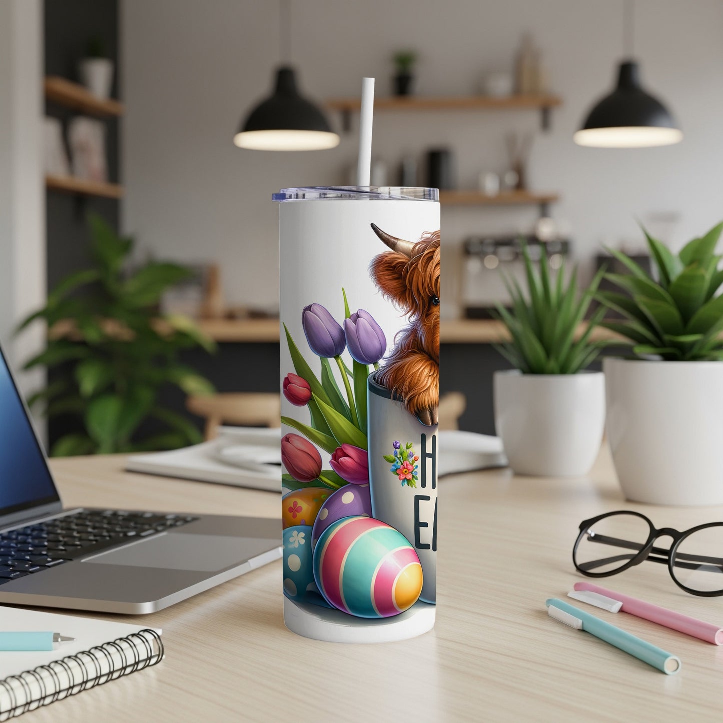 Highland cow with Easter eggs and tulips on a tumbler.