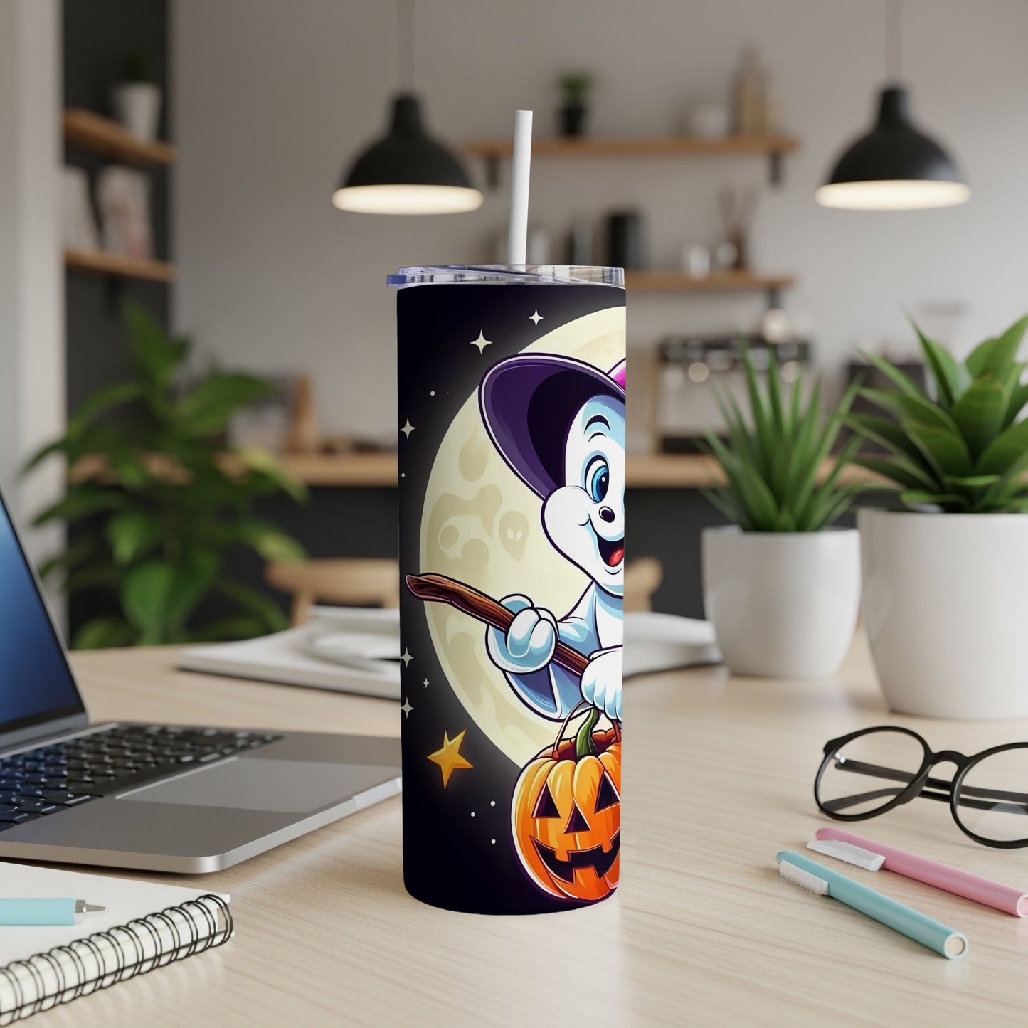 Halloween tumbler with cartoon ghost flying broomstick and pumpkin.