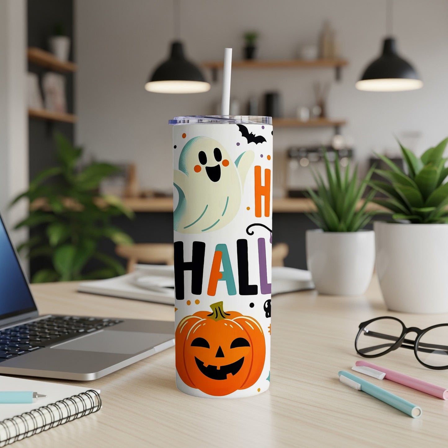 Halloween tumbler with ghost, pumpkin, bats, and "Happy Halloween" text.
