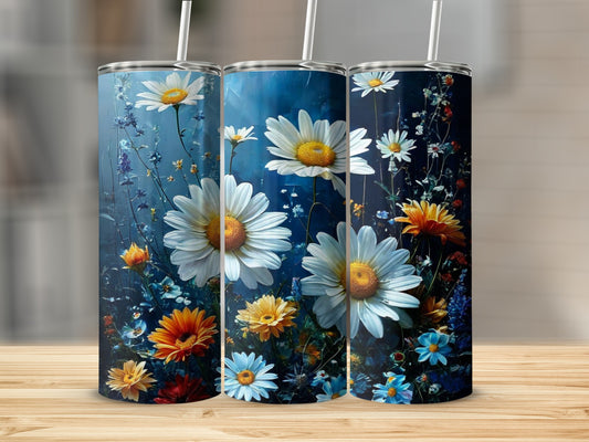Three tumblers with white daisies and colorful wildflowers on a dark blue background.