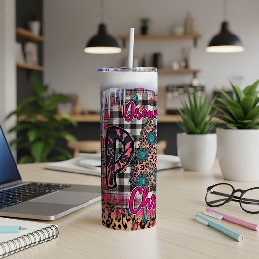 Tumbler with "Dream" and "Christmas" text and floral pattern.