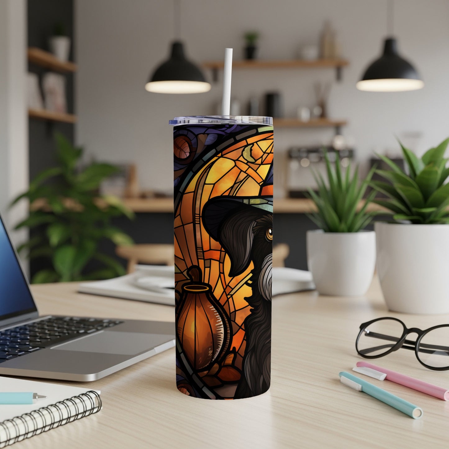 Stained glass tumbler featuring a black dog wearing a witch hat and holding a pumpkin.