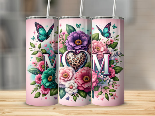 Pink tumbler with "Mom" surrounded by colorful flowers and butterflies.