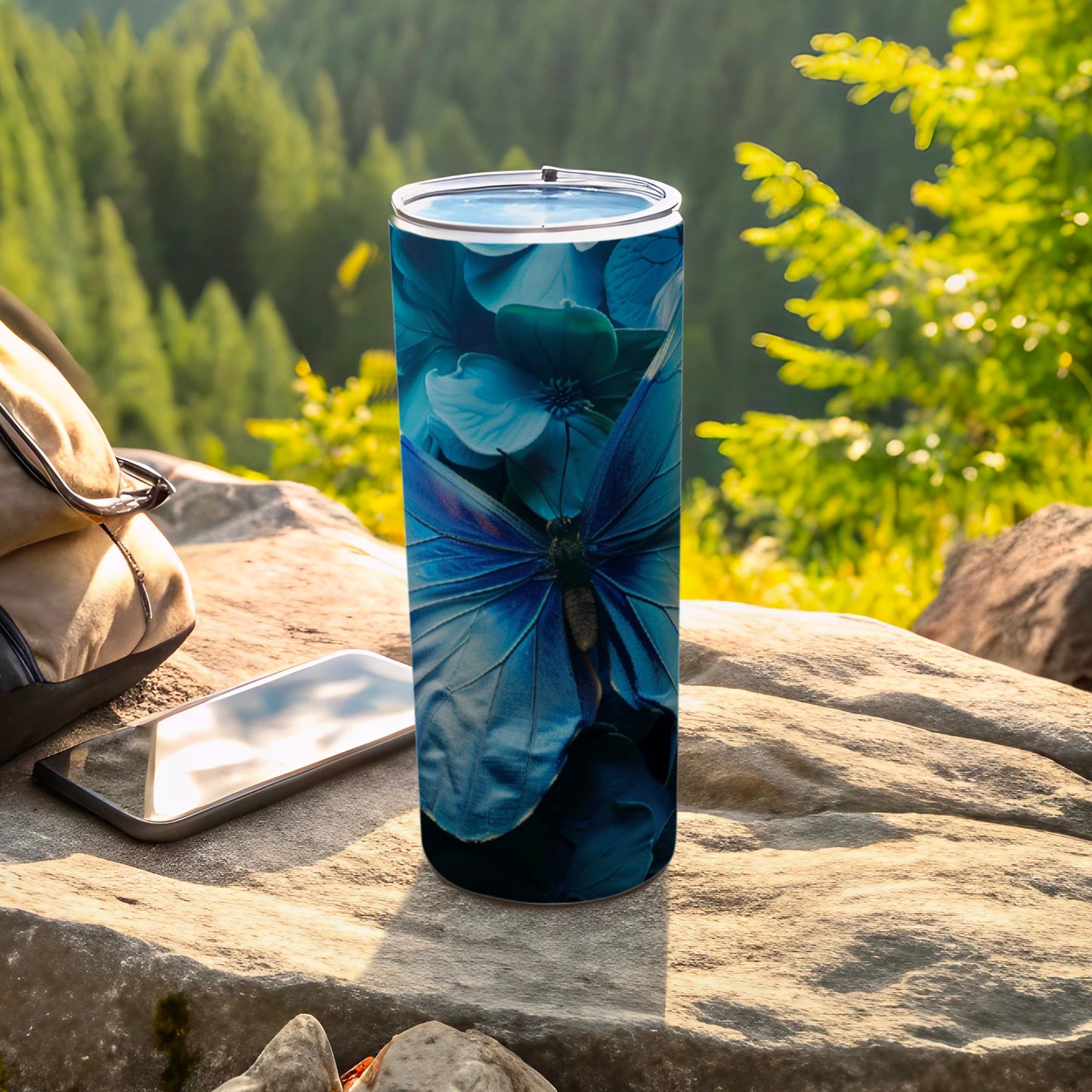 Blue butterfly on a floral background on a tumbler.