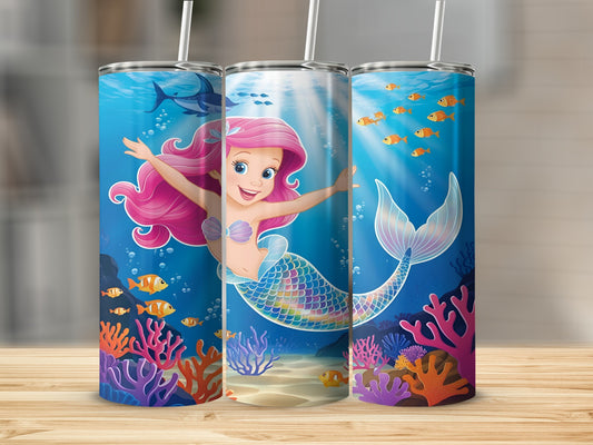 Ariel the mermaid swims happily among coral and fish.