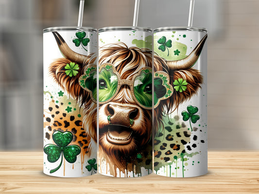 Highland cow wearing clover-shaped sunglasses, St. Patrick's Day themed tumbler design.