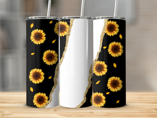 Three tumblers with sunflowers and gold glitter accents on a wooden surface.