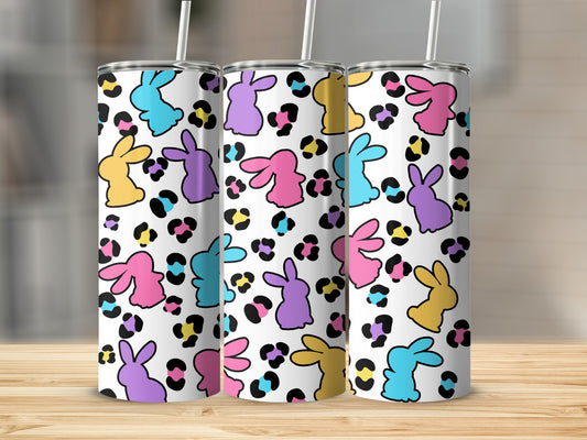 Three tumblers with colorful bunnies and leopard print pattern.
