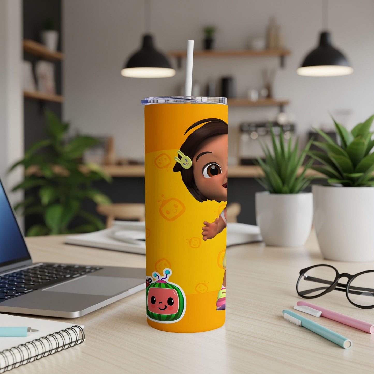 Cocomelon character on a bright yellow tumbler with a white straw.
