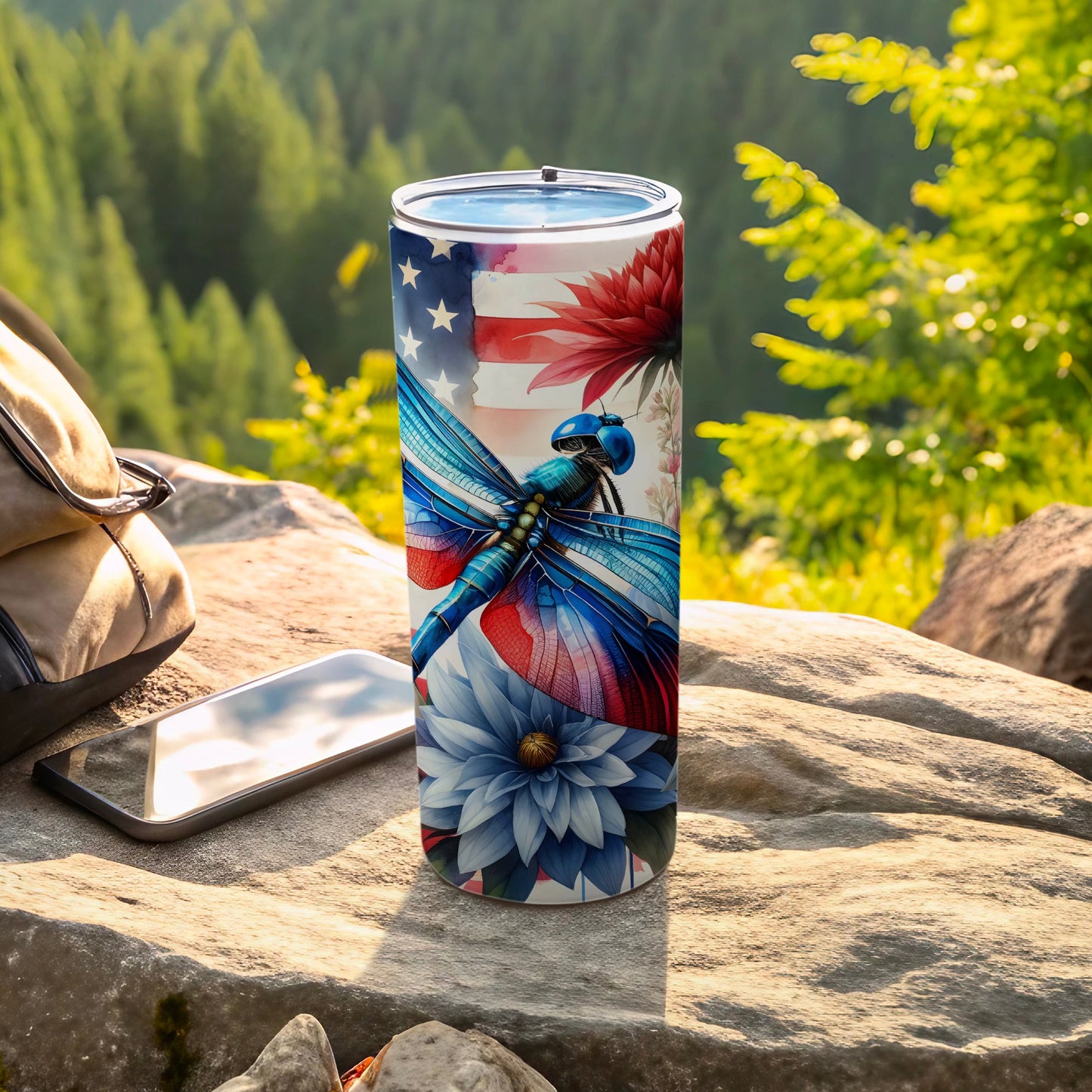 Patriotic dragonfly and flowers design on a travel tumbler.