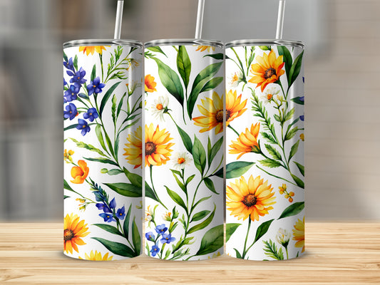 Three white tumblers with a floral pattern of sunflowers and blue flowers.
