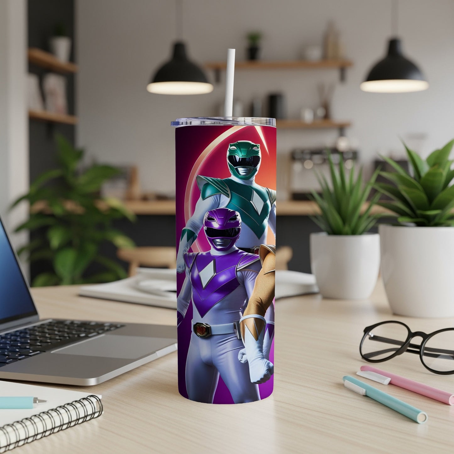 Purple and green Power Rangers on a purple and pink tumbler with a straw.