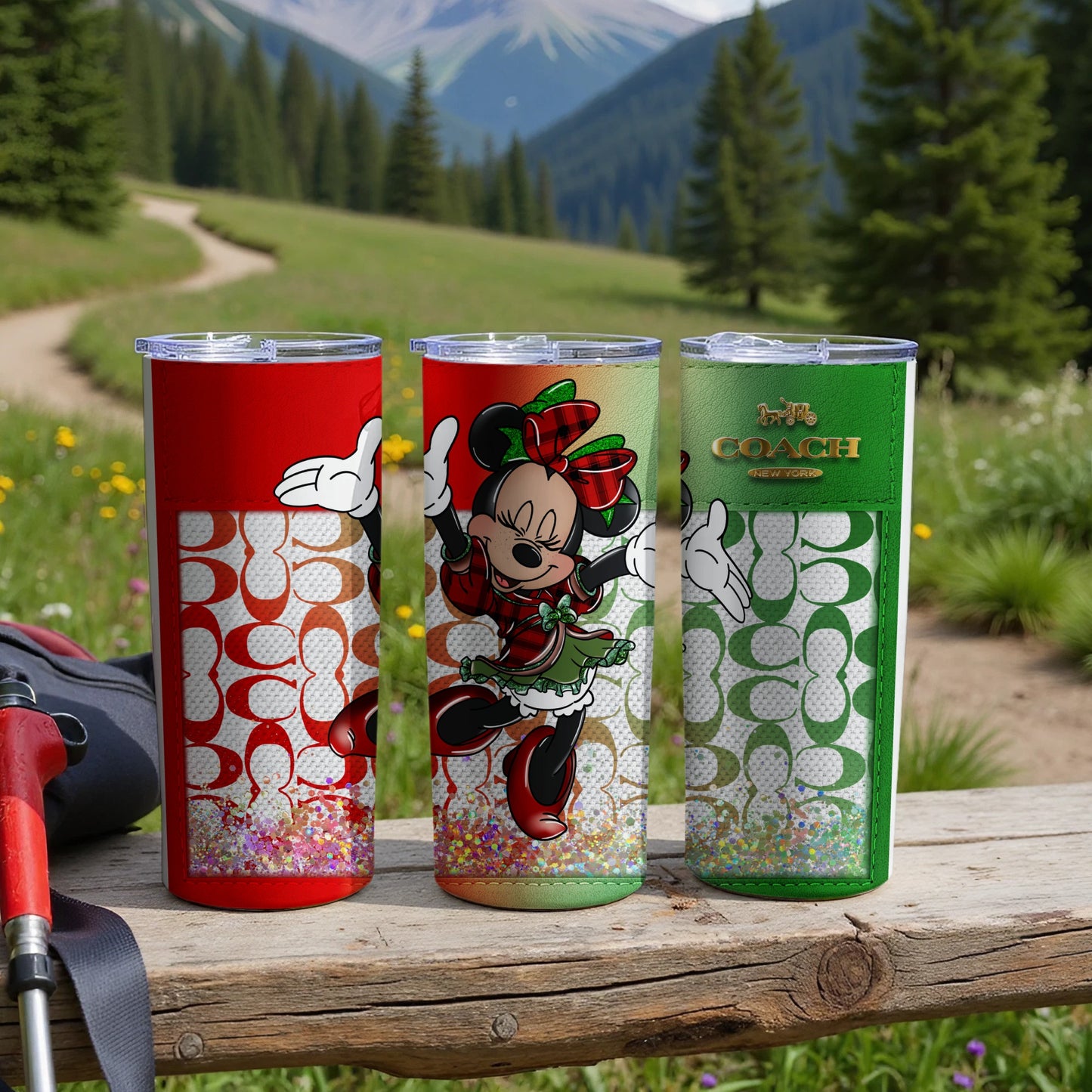 Three Coach tumblers with Minnie Mouse designs and glitter accents.