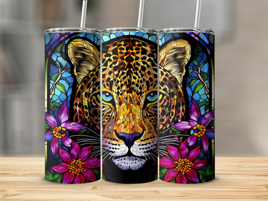 Leopard face in stained glass style with floral accents on a tumbler.
