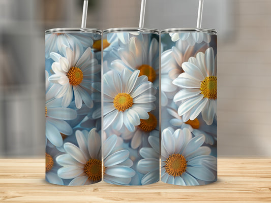Three tumblers with a close-up pattern of white daisies and yellow centers.