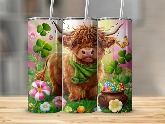 Highland cow with green scarf surrounded by shamrocks and colorful candies in a pot.
