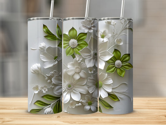 Three white tumblers with raised green and white floral designs.