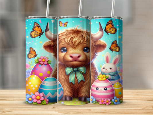 Fluffy Highland calf with Easter eggs and butterflies on a tumbler.