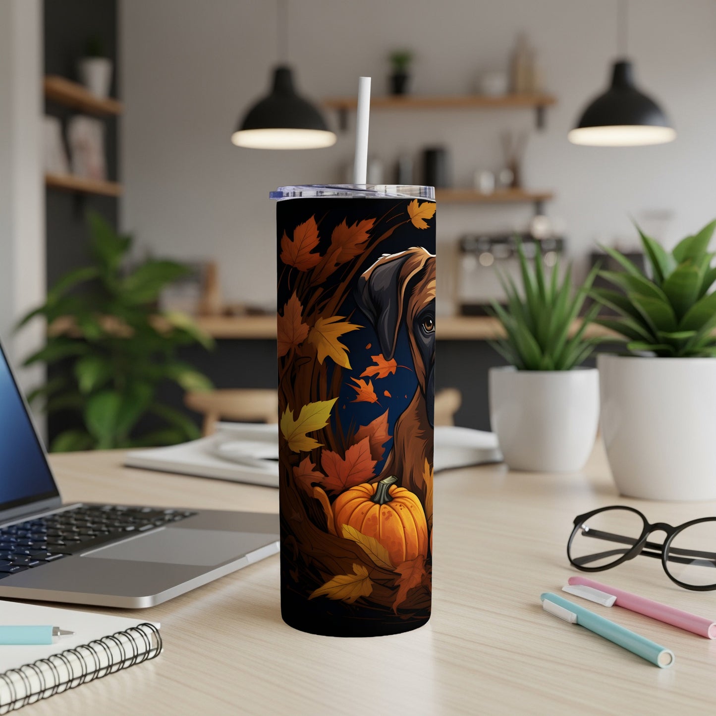 Tumbler with dog and autumn leaves design, featuring a pumpkin.