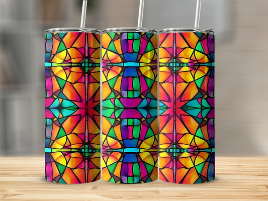 Three stained glass tumblers with colorful geometric patterns displayed on a wooden surface.