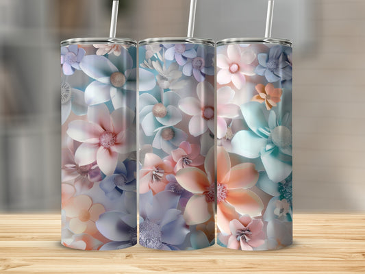 Three tumblers with pastel floral designs and straws.