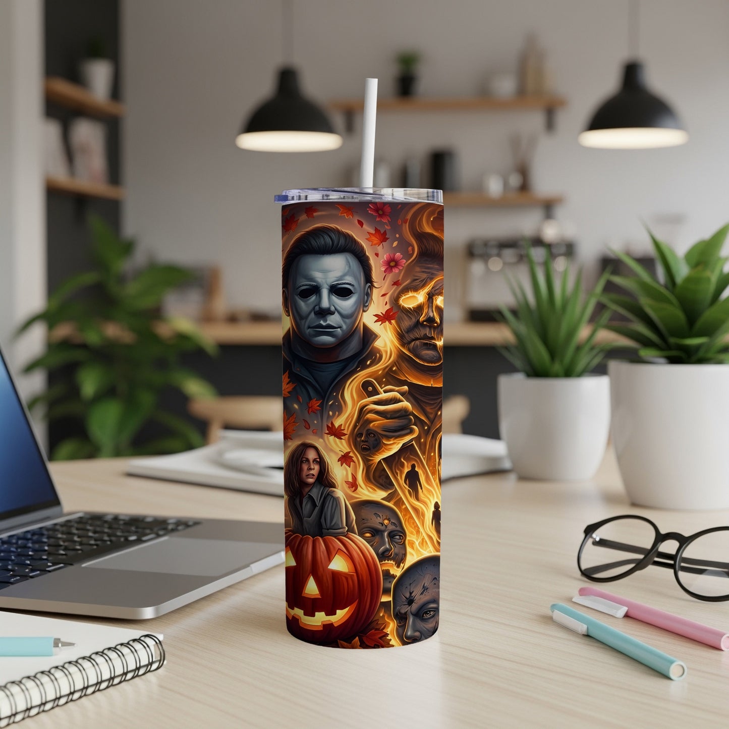 Tumbler featuring Michael Myers, flaming faces, a pumpkin, and autumn leaves.