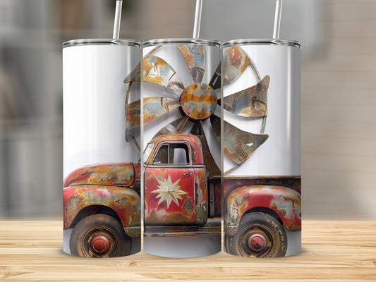 Rusty vintage red truck with metal windmill blades design on tumblers.
