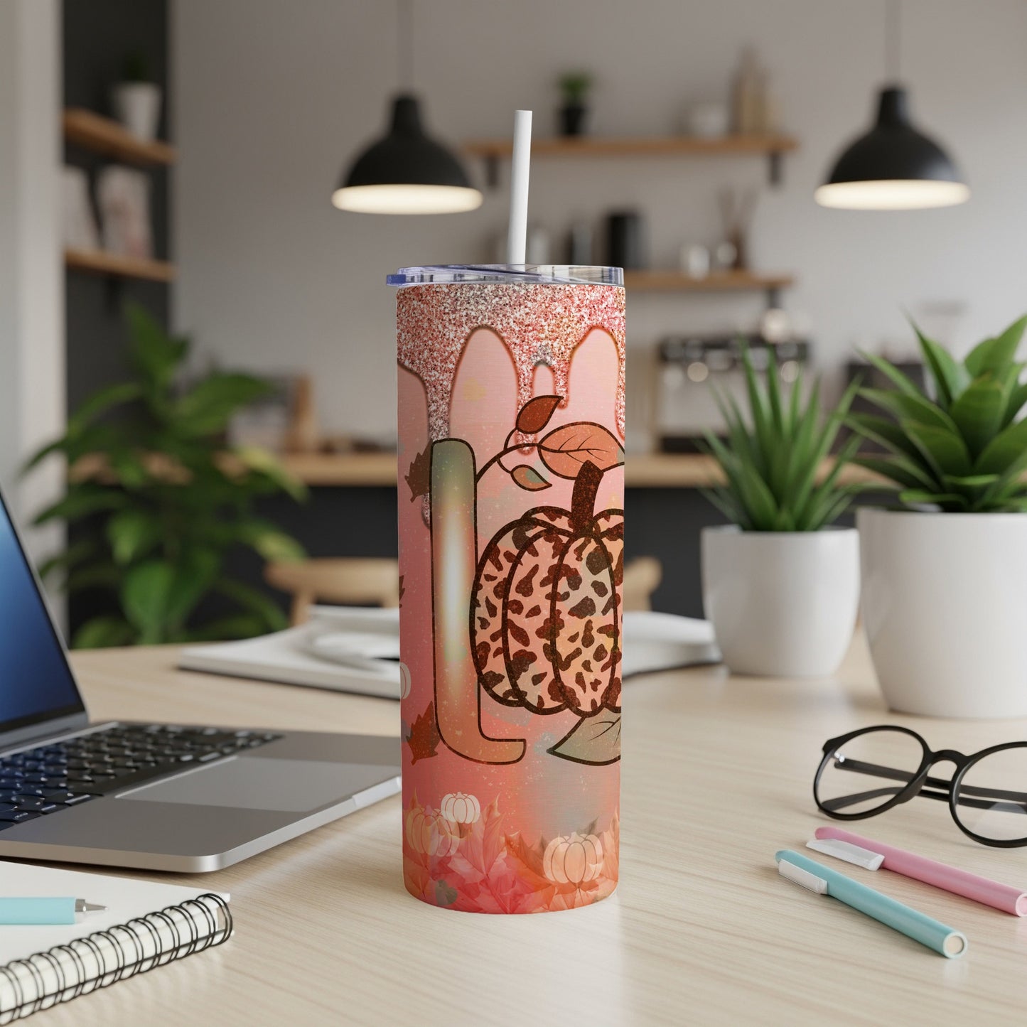 Tumbler with "Fall" text, pumpkin graphics, and autumn leaves.