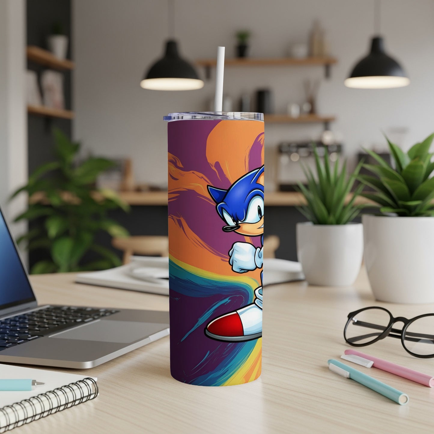 Sonic the Hedgehog character on a colorful abstract patterned tumbler with a straw.