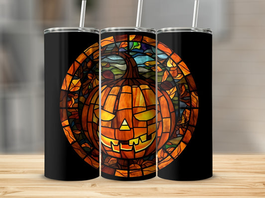 Black tumbler with stained glass pumpkin design for Halloween.