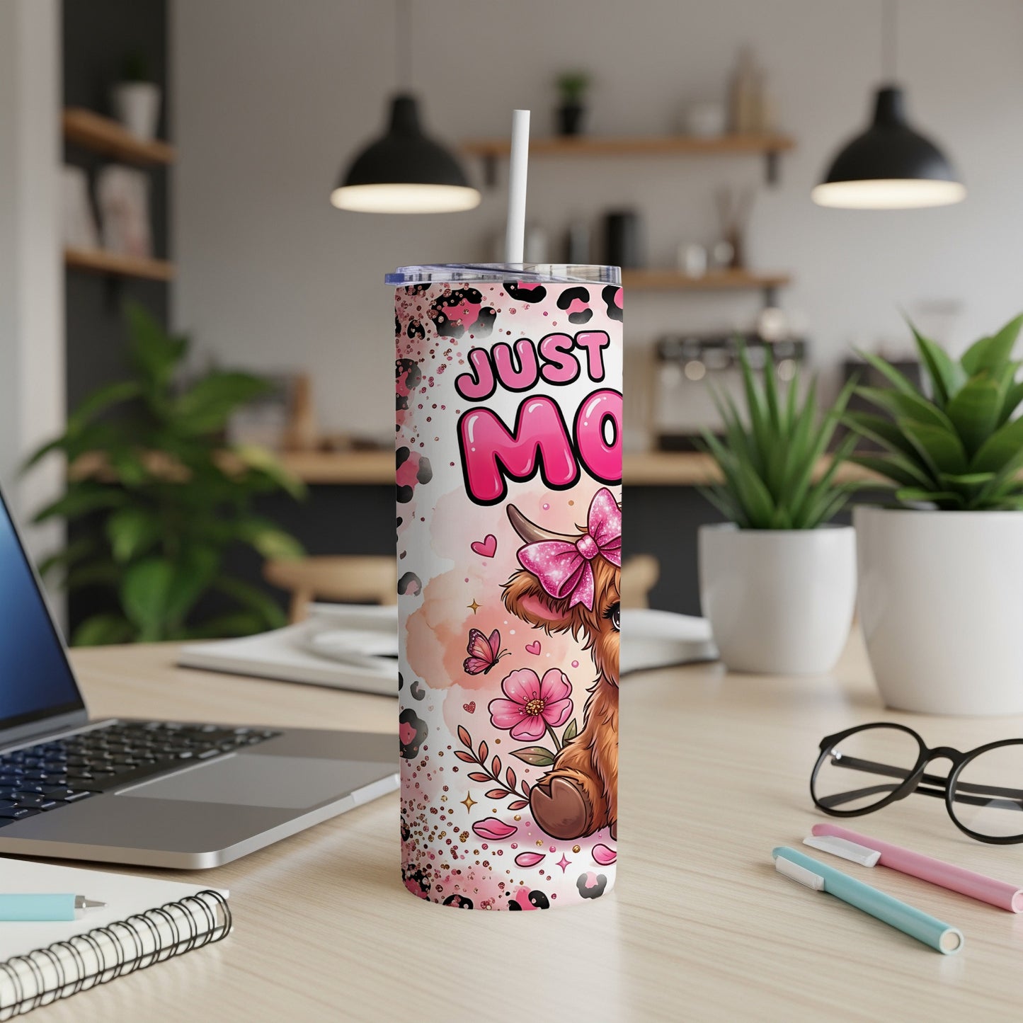 Pink tumbler with cow, bow, and text "Just Moo".