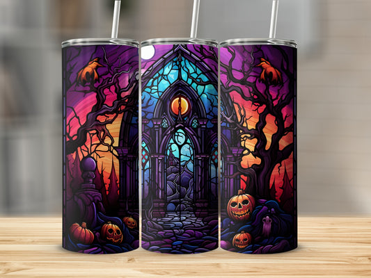 Halloween tumbler with stained glass, pumpkins, and spooky trees.