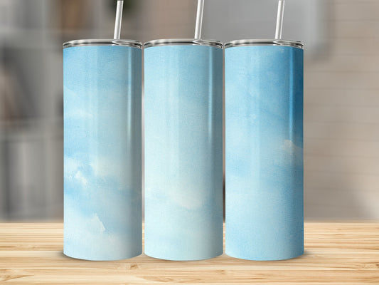 Three tumblers with a light blue watercolor sky pattern and straws.