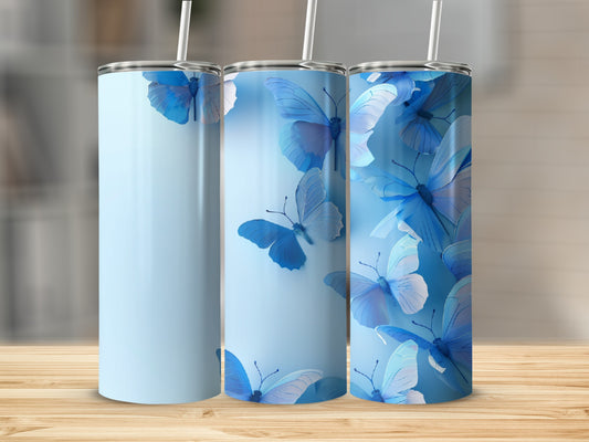 Light blue tumbler with blue butterflies, on a wooden surface.