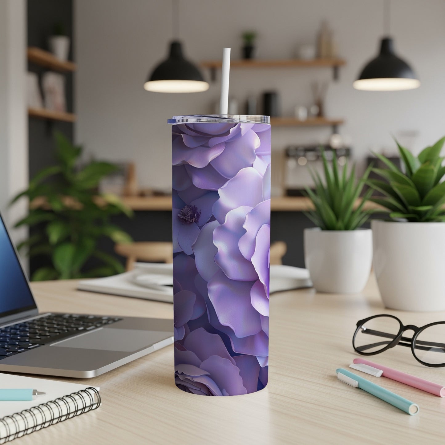 Purple floral pattern on a stainless steel tumbler with a straw.