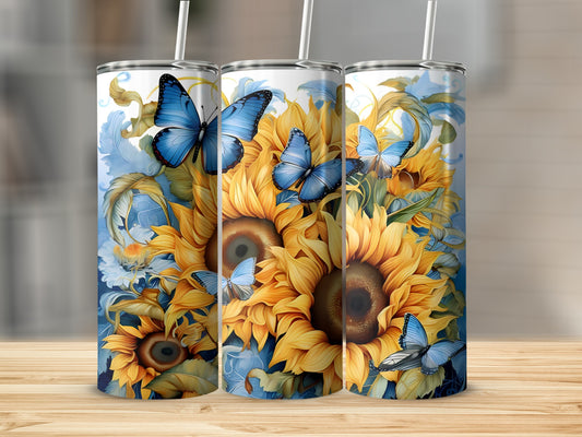 Three tumblers with sunflowers and blue butterflies on a wooden surface.
