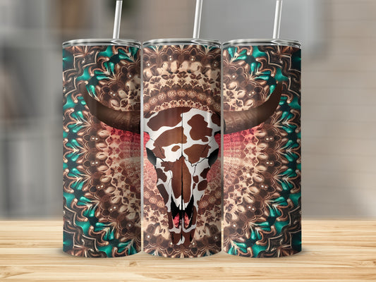 Cow skull with ornate mandala pattern on three tumblers.