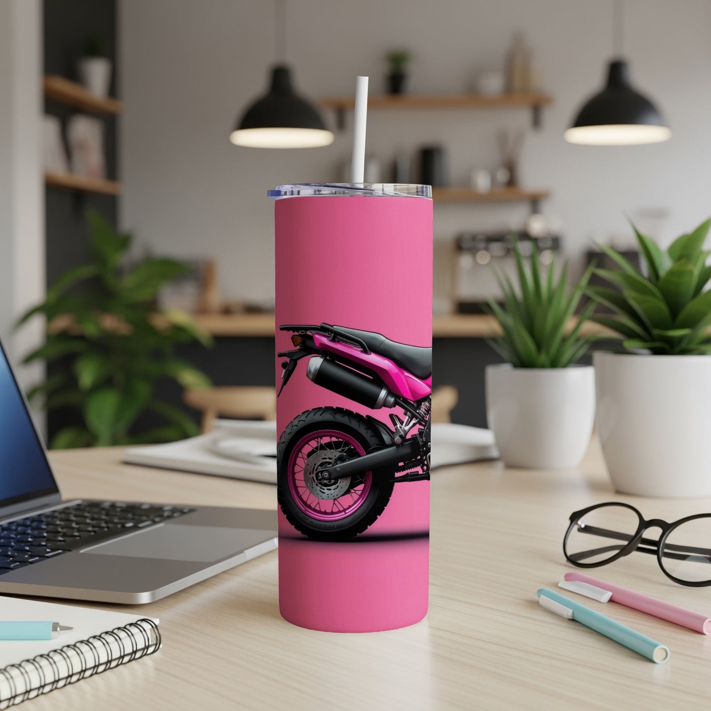 Pink tumbler with motorcycle tire and wheel design.