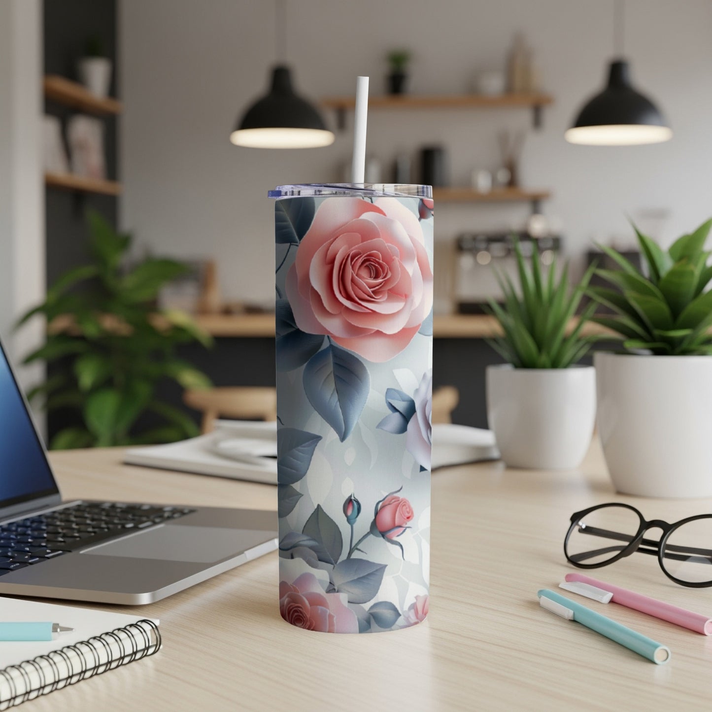 Floral skinny tumbler with roses and blue accents.
