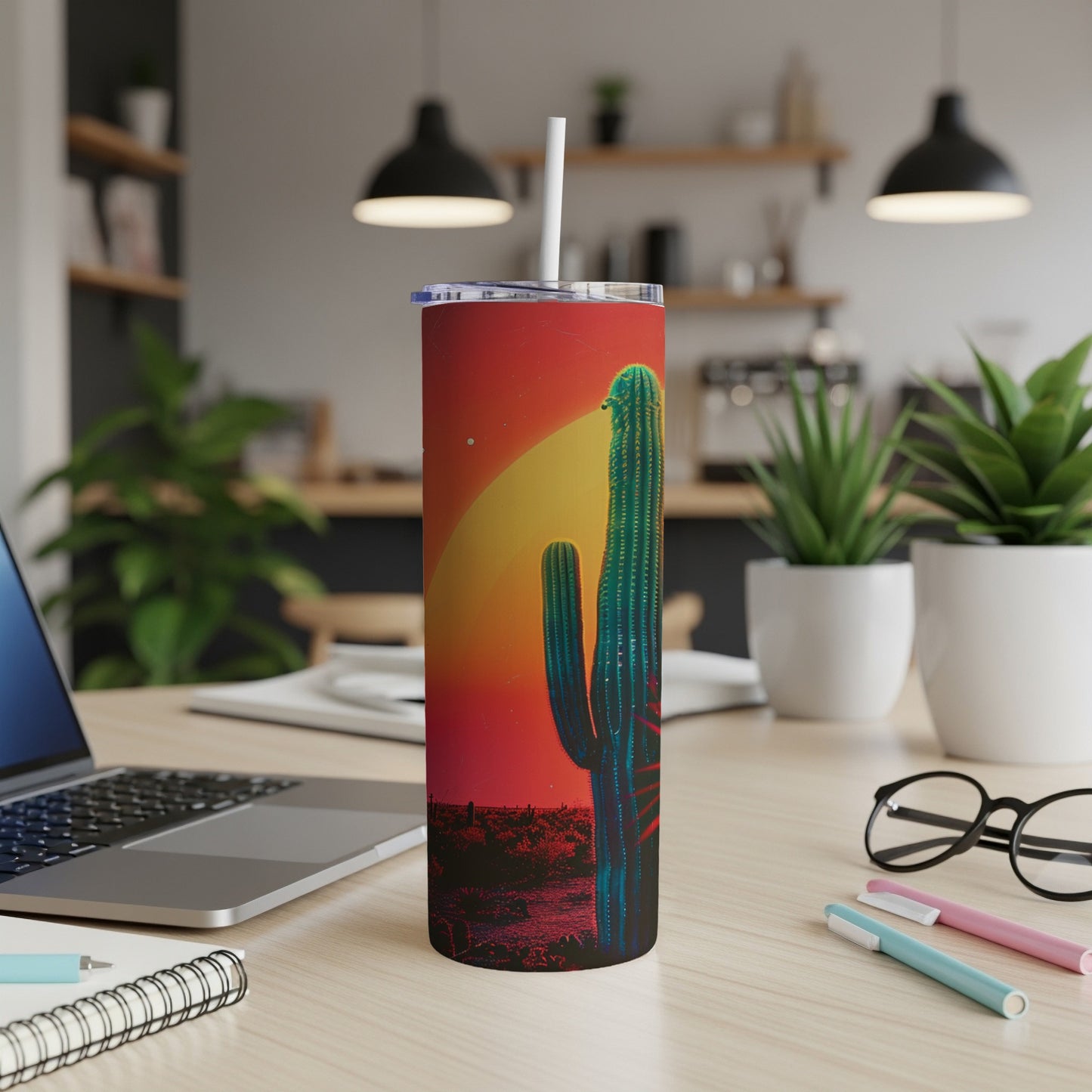 Tall Saguaro cactus under a setting sun on a red gradient tumbler.