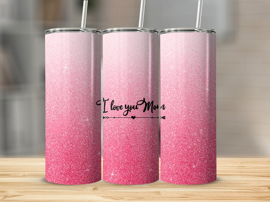 Pink glitter tumbler with "I Love You Mom" text on a wooden surface.