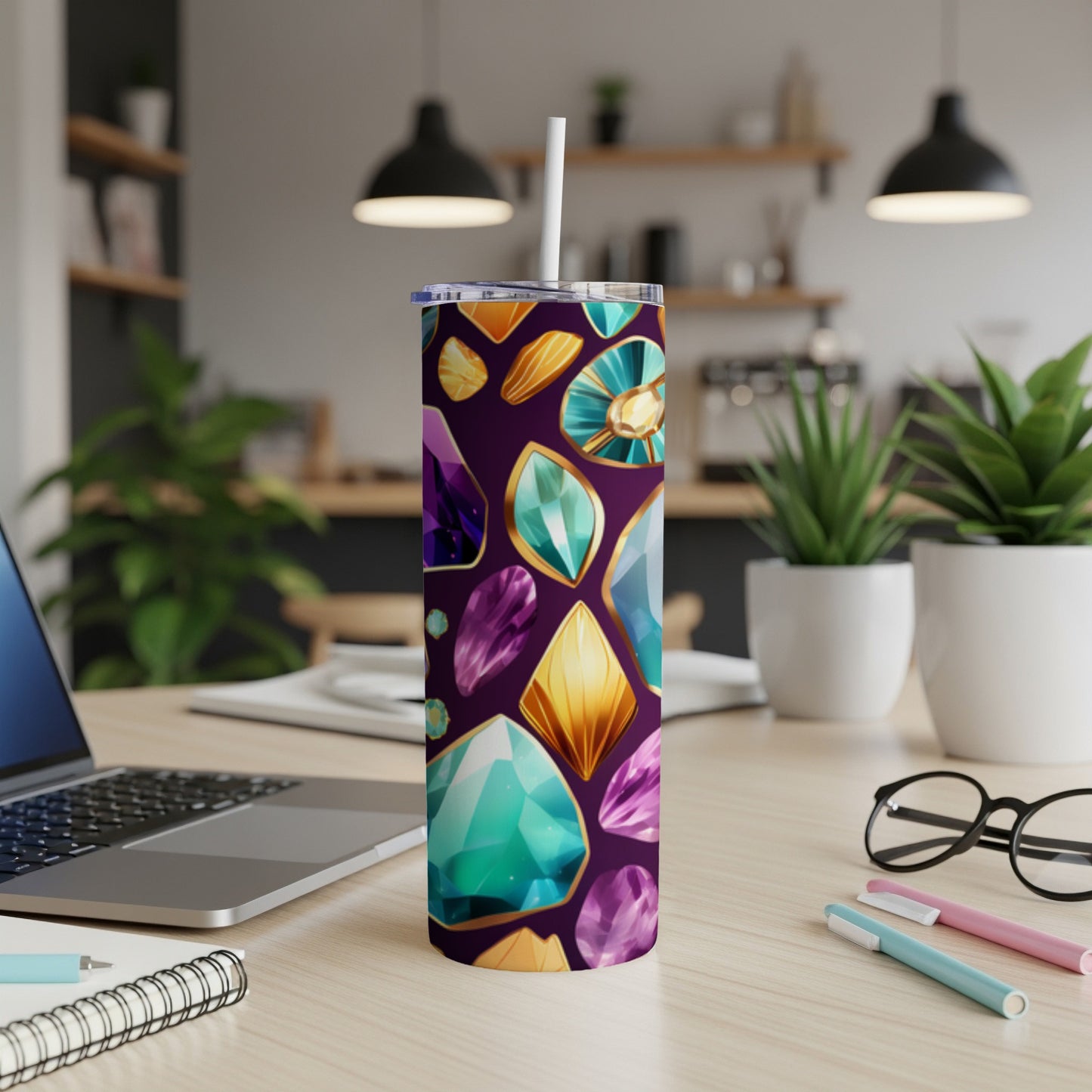 Tumbler with a vibrant pattern of colorful, faceted gemstones.