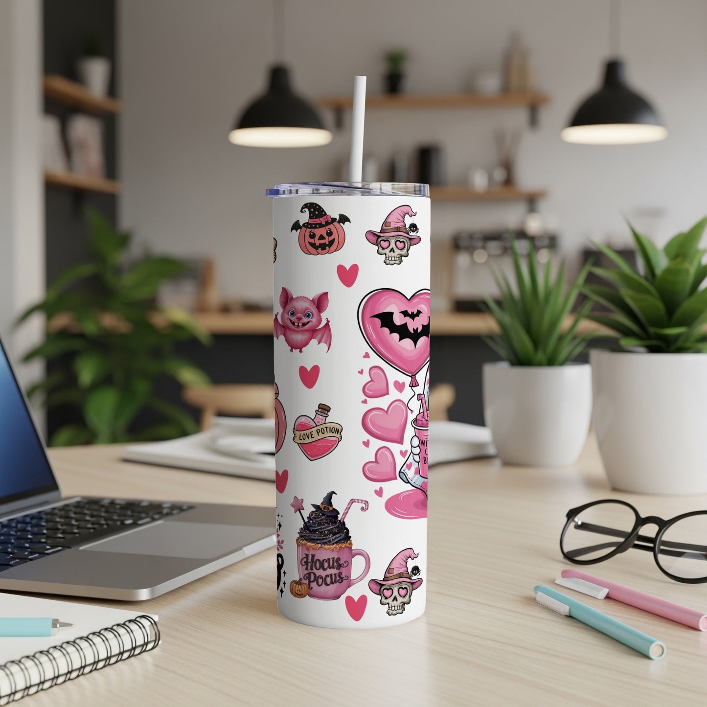 White tumbler with Halloween-themed pink and black cartoon icons and text.