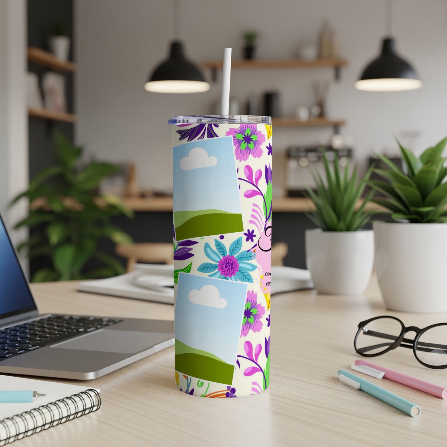 Floral patterned tumbler with two photo placeholders and a straw, on a desk.