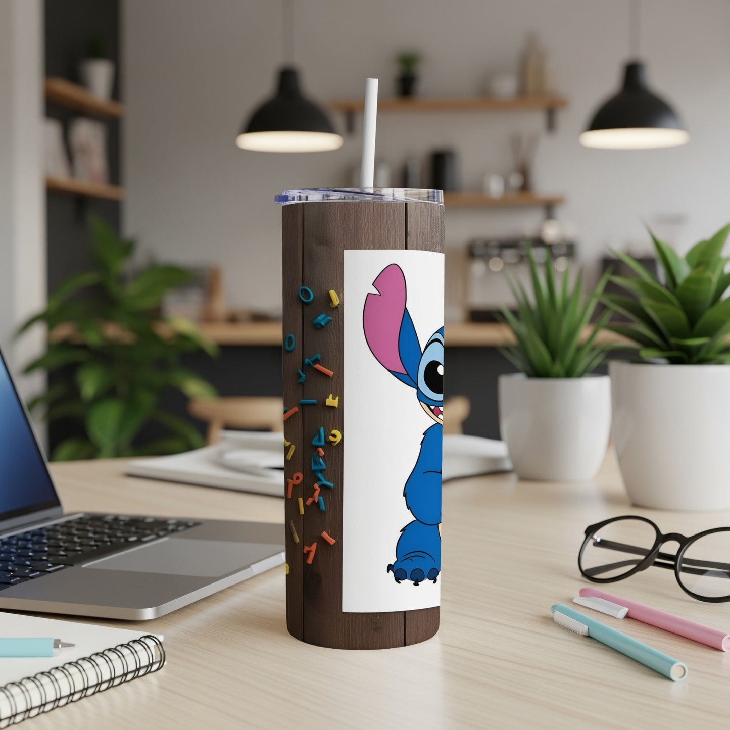 Stitch character design on a dark wood patterned tumbler with colorful alphabet letters.