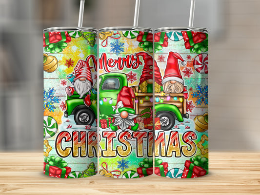 Three Christmas gnomes and a truck with "Merry Christmas" text on a tumbler.