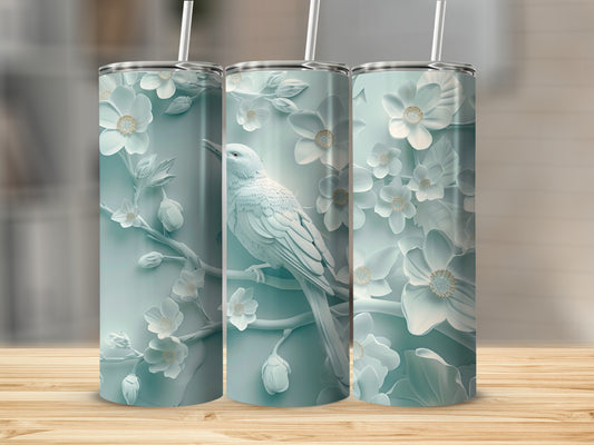 Light blue tumbler with embossed white bird and floral design.