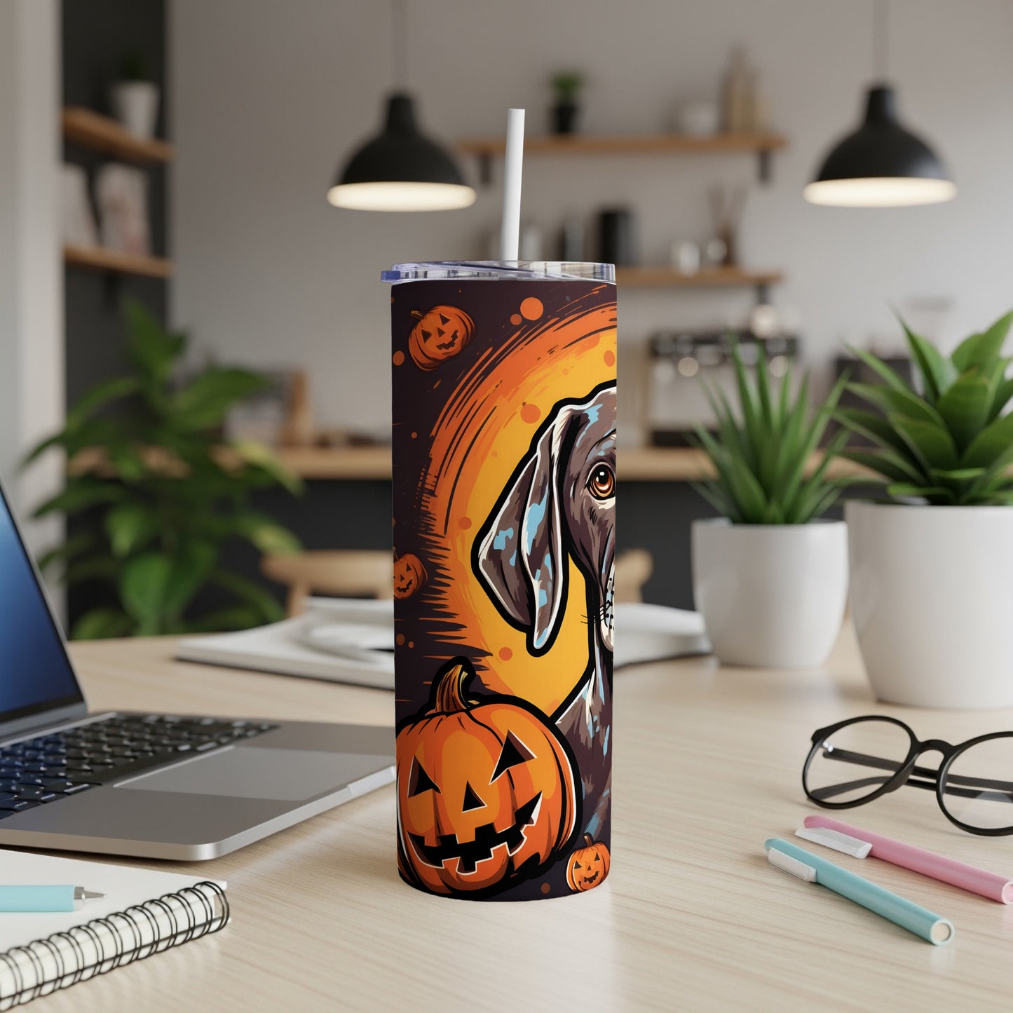 Halloween dog and pumpkin design on a tumbler with a straw.
