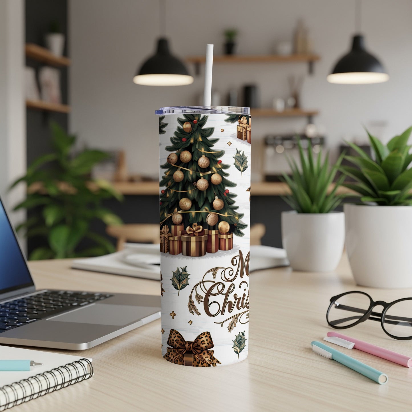 Christmas tree and gifts on a tumbler with "Merry Christmas" text.